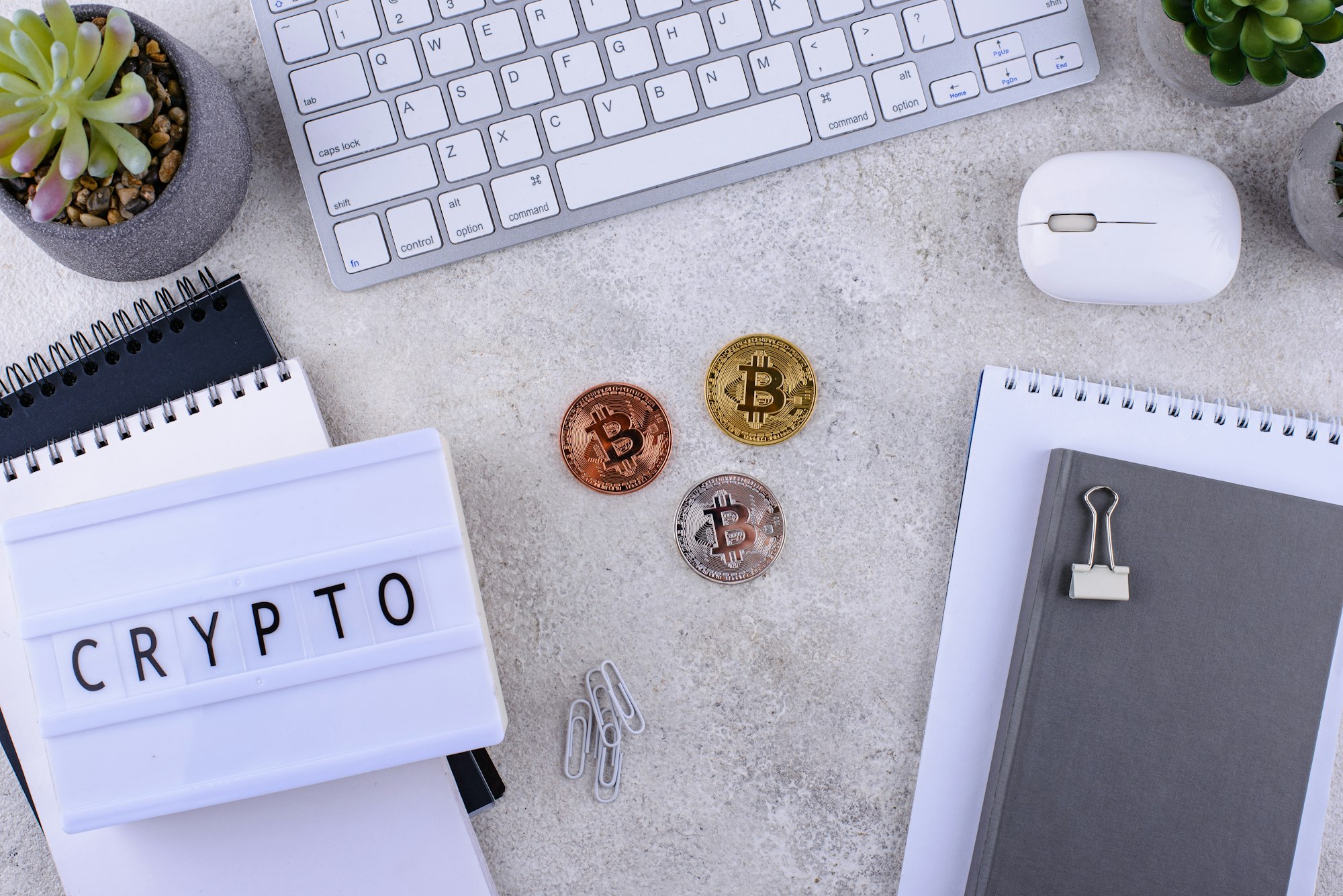 Bitcoin coins on office desk. Cryptocurrency concept