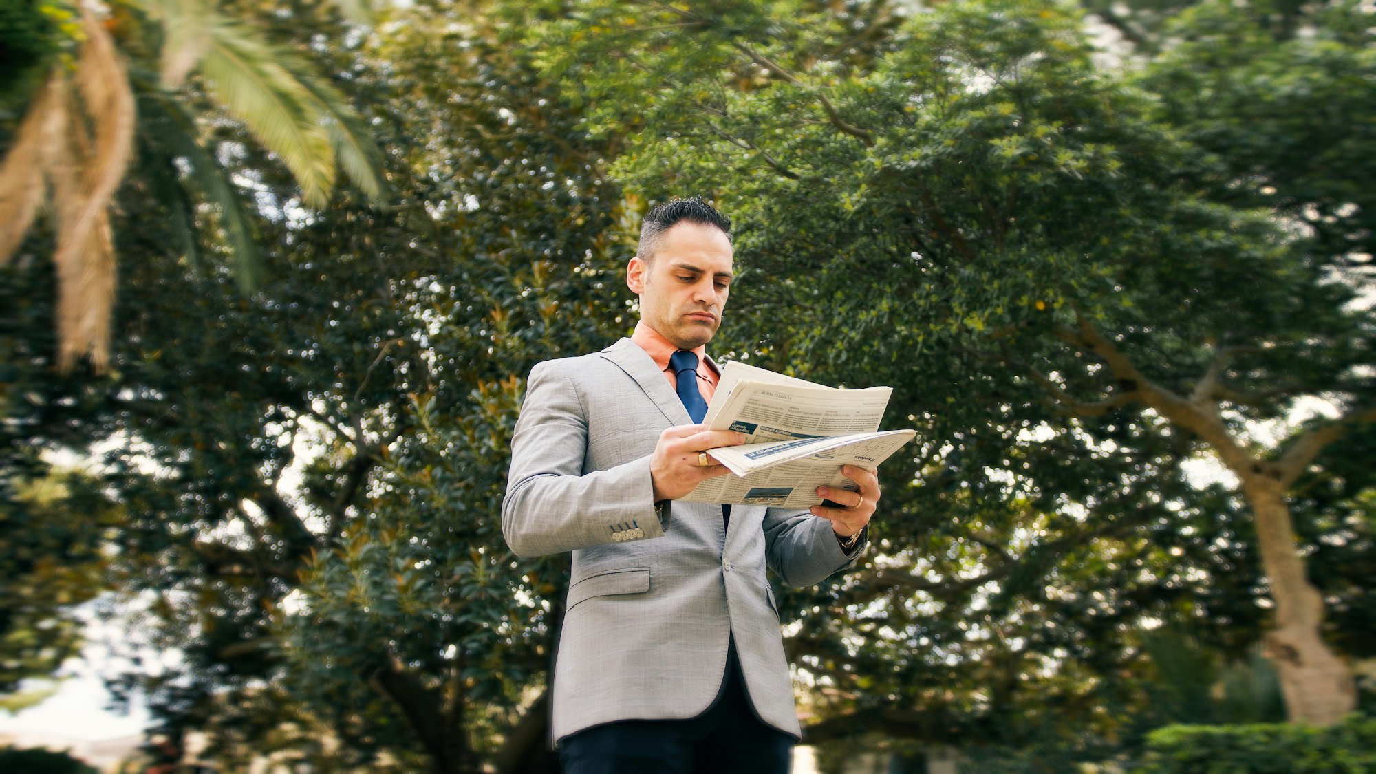 Man With The Newspaper In The Park